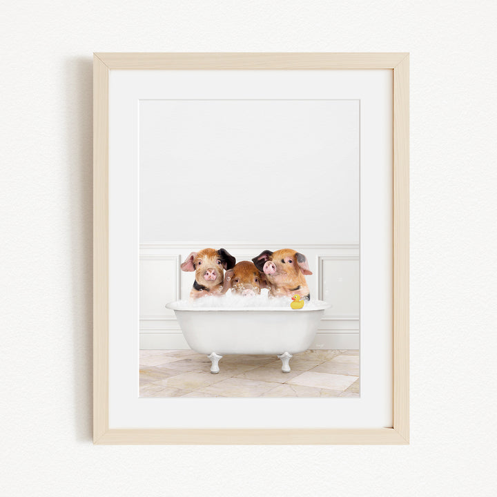 Three adorable pigs sitting in a white bathtub, enjoying a relaxing bath.