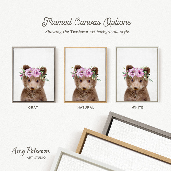three framed canvas options, each featuring a bear wearing a flower crown. The options are labeled as "Grays," "NATURAL," and "WHITE," indicating the color of the frame. The text " Framed Canvas Options" is displayed above the options, and "Showing the Texture art background style." is written below the bear images. The artist's name, " Amy Peterson," is also included at the bottom of the image.