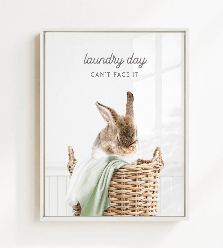 A cute rabbit sitting in a wicker basket, with the text "laundry day can't face it" written above it.