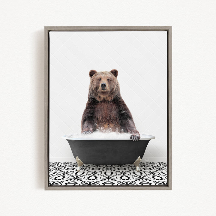 A brown bear sitting in a black bathtub filled with water, surrounded by a black and white patterned floor.
