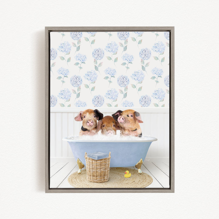 Three adorable pigs sitting in a blue bathtub, surrounded by a floral patterned wall and a yellow rubber duck.