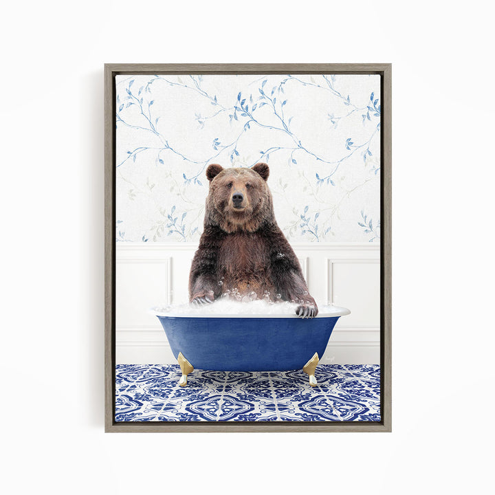 A brown bear sitting in a blue bathtub filled with water, surrounded by a blue and white patterned floor.