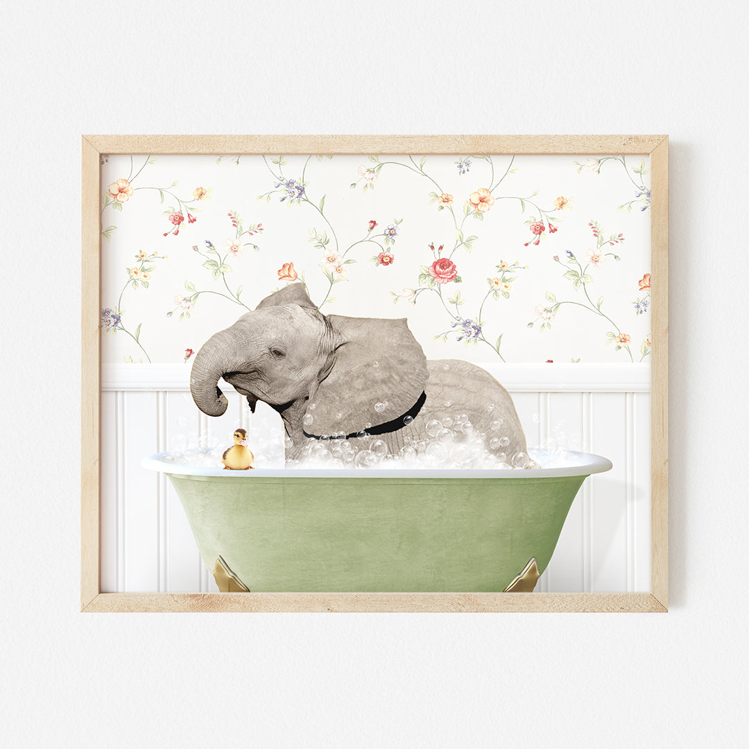 an elephant taking a bath in a green bathtub