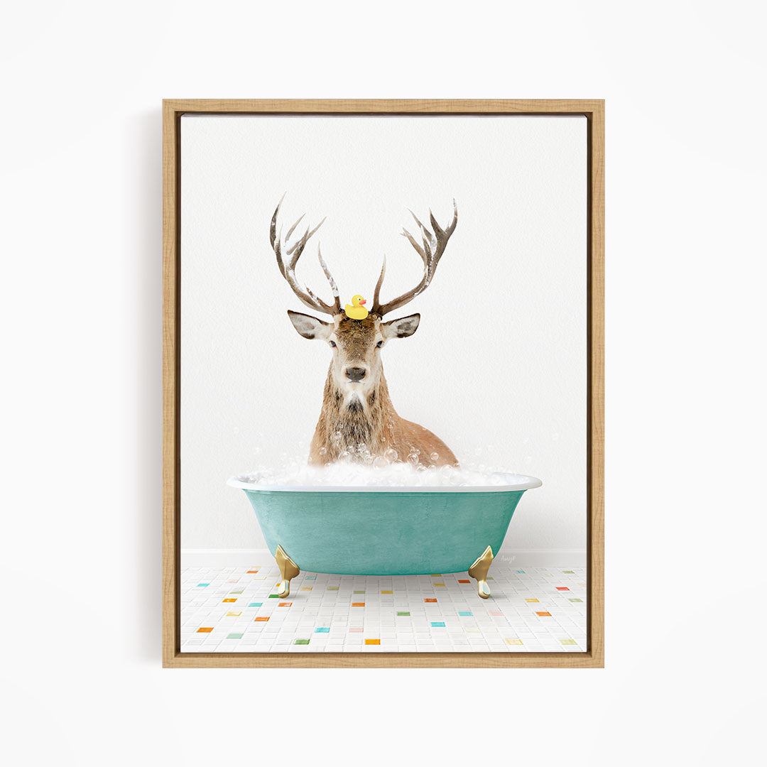 A deer with antlers is sitting in a blue bathtub filled with bubbles, with a yellow rubber duck perched on its head.