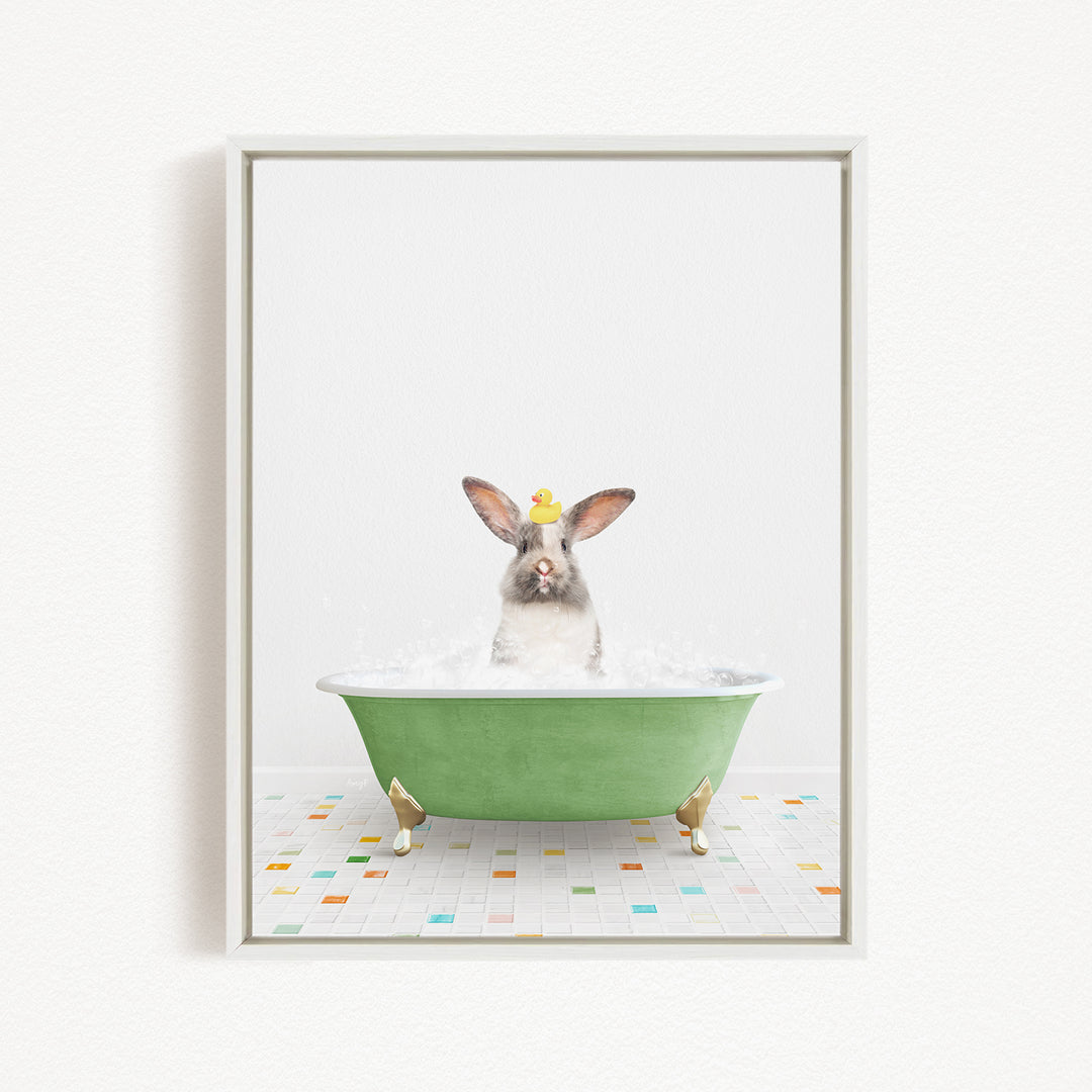 A rabbit sitting in a green bathtub filled with water, surrounded by colorful tiles on the floor.