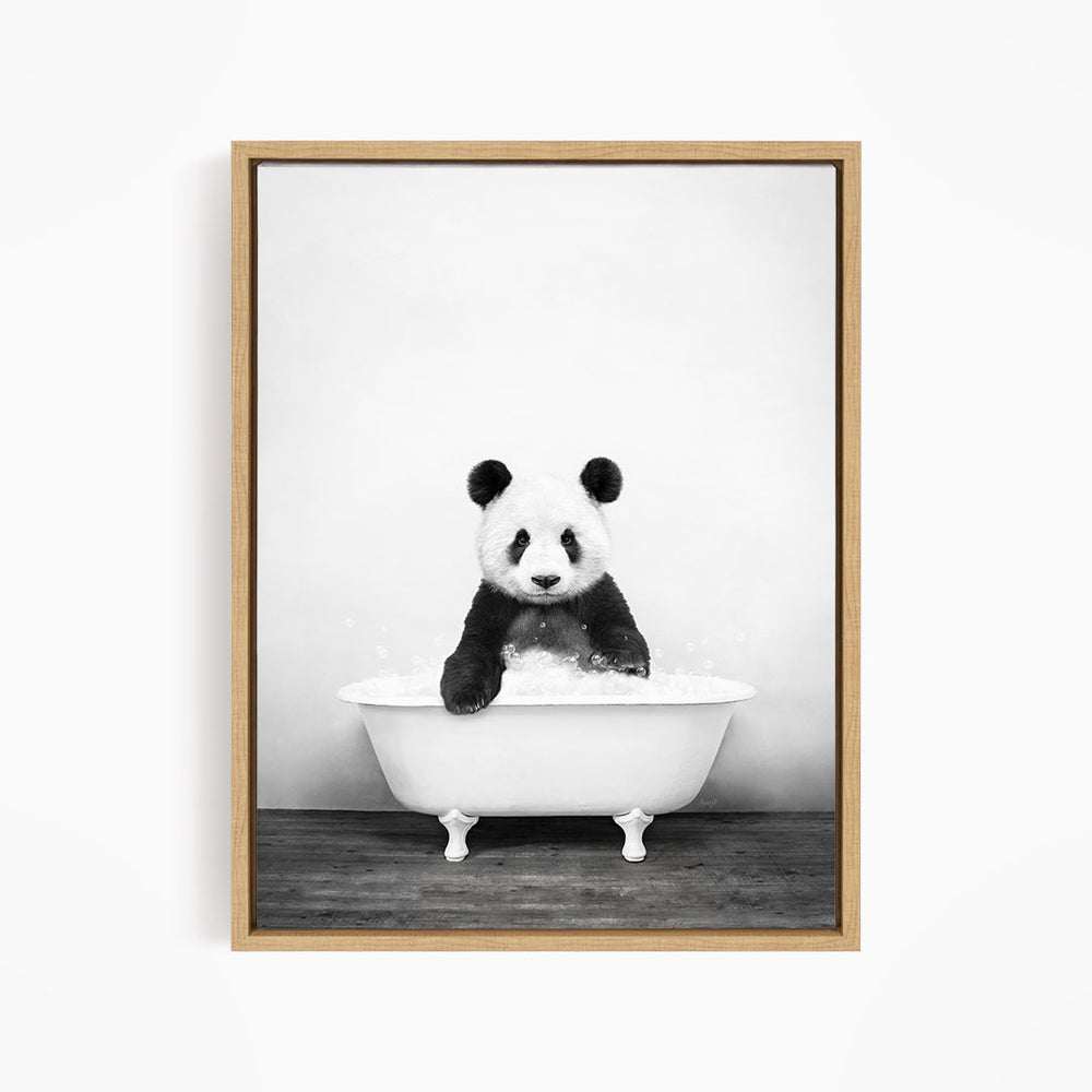 A panda bear sitting in a white bathtub filled with water, creating a playful and whimsical scene.