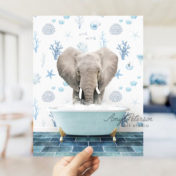 a person holding up a picture of an elephant in a bathtub