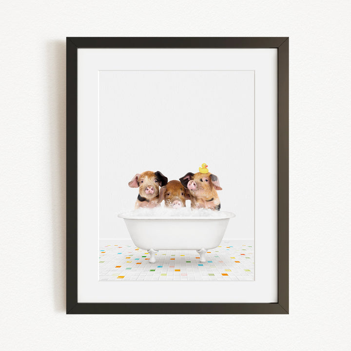 Three adorable pigs sitting in a white bathtub, enjoying a relaxing bath together.