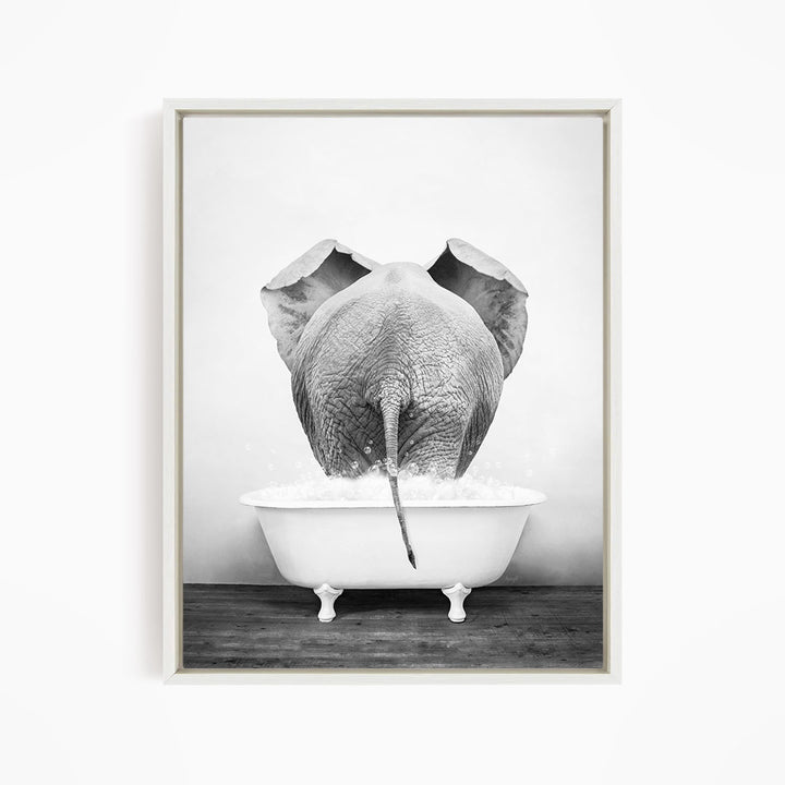 A black and white photograph of an elephant standing in a bathtub filled with water, with its trunk submerged in the water.