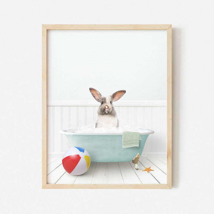 a picture of a bunny in a bathtub with a beach ball