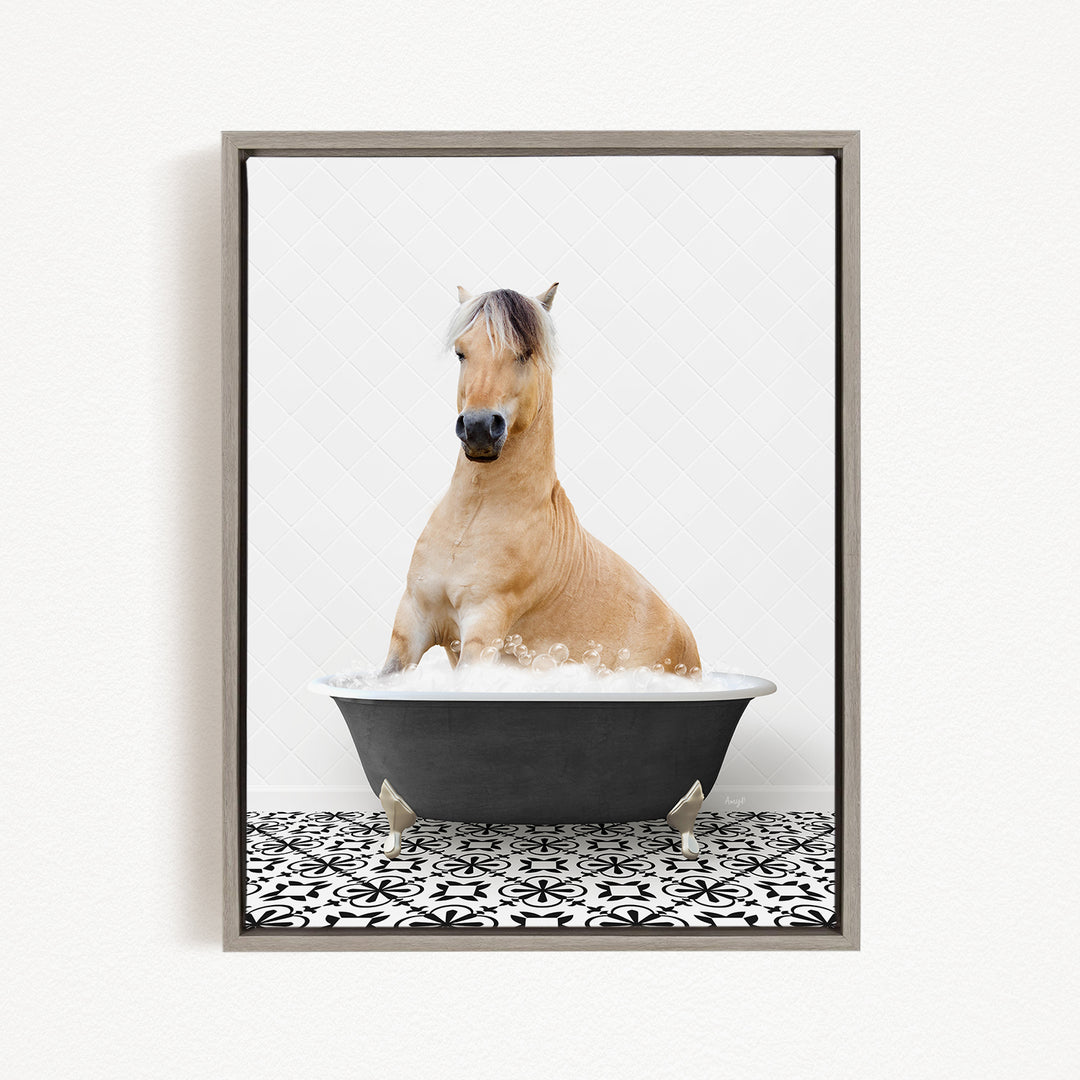 A light brown horse is sitting in a black bathtub filled with water, creating a whimsical and playful scene.
