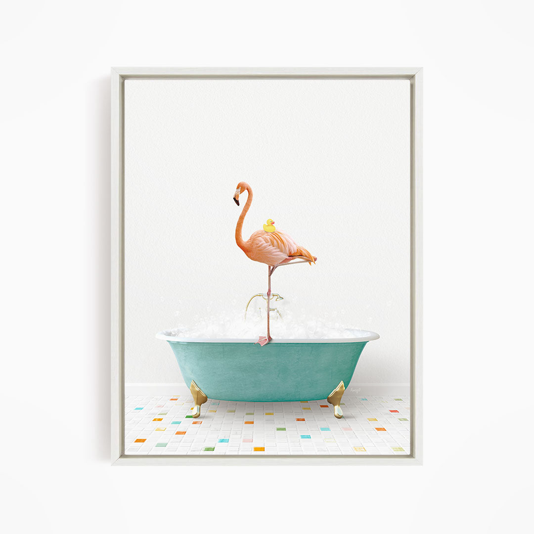 A pink flamingo stands on a green bathtub filled with bubbles, with a yellow duck perched on its back.