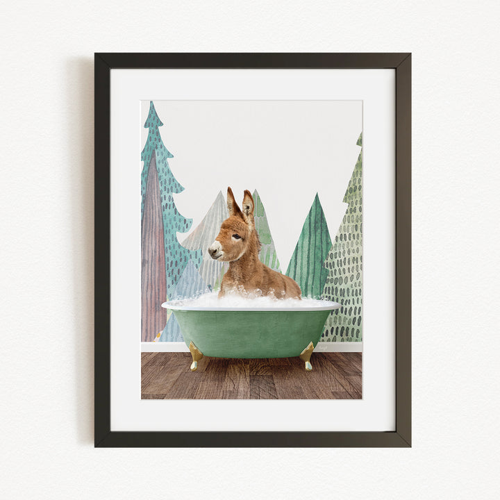 A brown kangaroo is sitting in a green bathtub, surrounded by a forest scene with trees and a snowy landscape.
