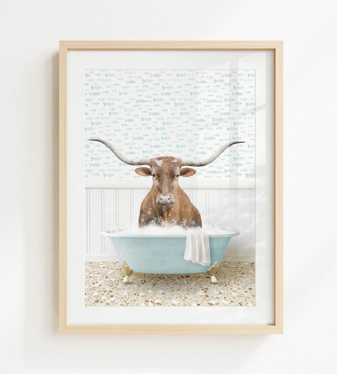 A picture of a horned animal, possibly a cow or a bull, sitting in a blue bathtub filled with bubbles.