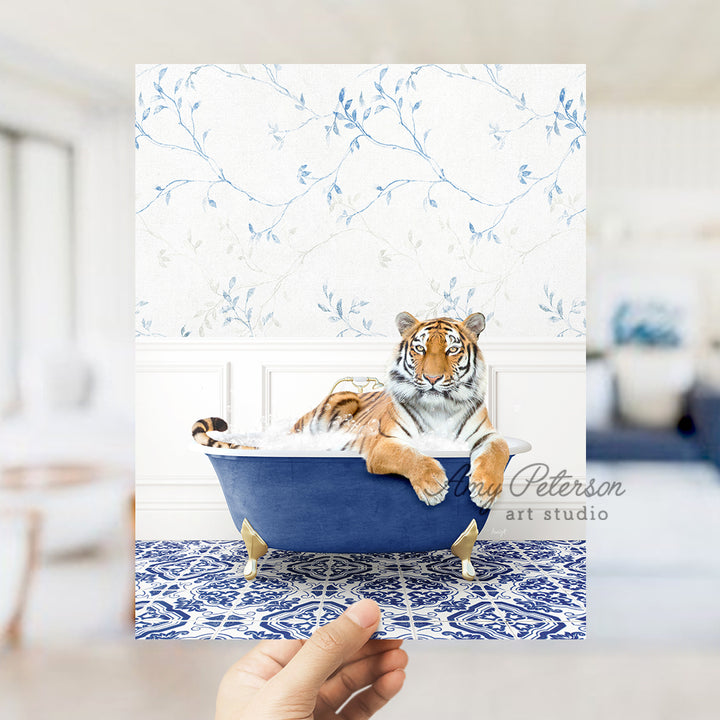 a hand holding a card with a picture of a tiger in a bathtub