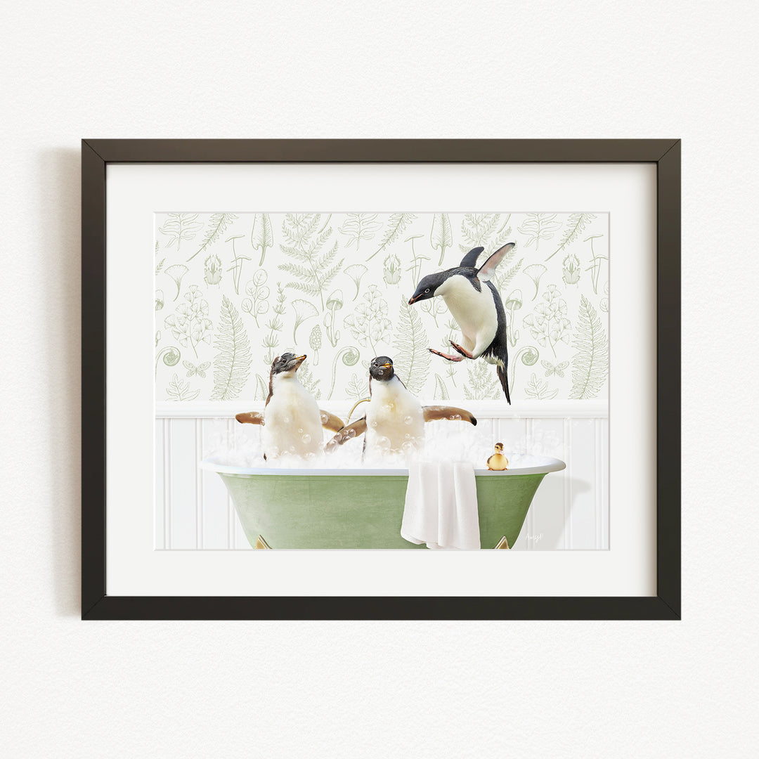 A framed image depicting three penguins sitting in a green bathtub, with one penguin flying towards the others.