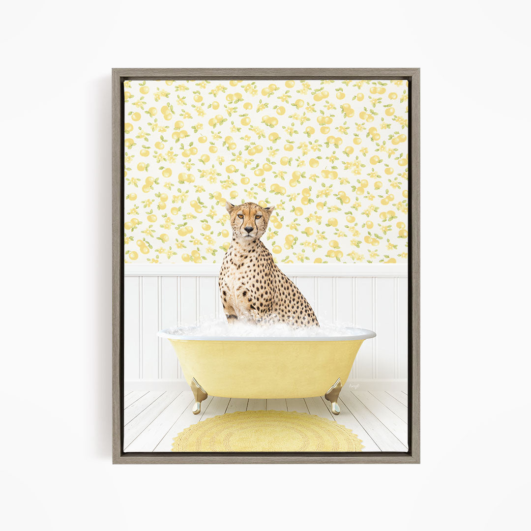 A cheetah sitting in a yellow bathtub filled with water, surrounded by a yellow and white floral patterned wall.