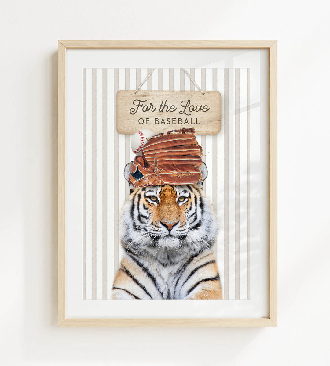A framed image of a tiger wearing a baseball cap and holding a baseball glove, with a sign above that says "For the Love of Baseball".
