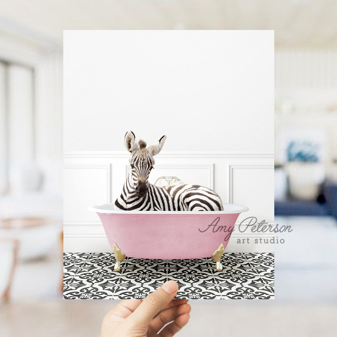 a zebra is sitting in a pink bathtub