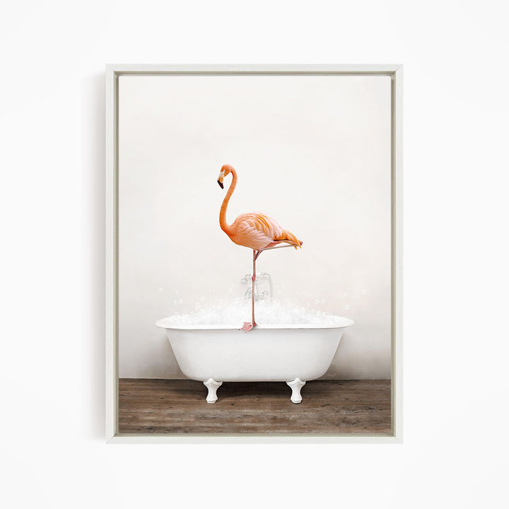 A vibrant orange flamingo stands on the edge of a white bathtub filled with water, creating a whimsical and playful scene.