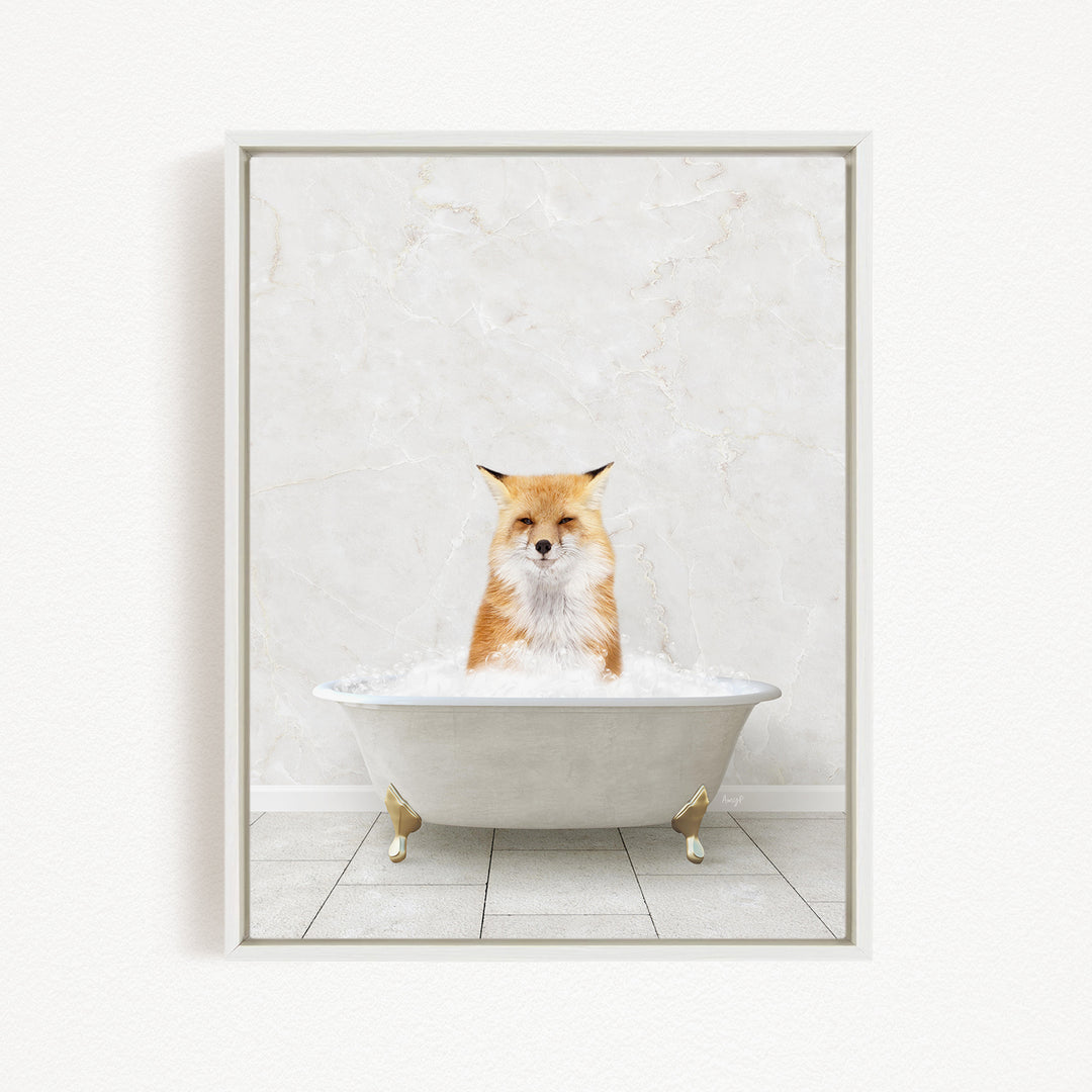 A red fox sitting in a white bathtub filled with bubbles, looking directly at the camera.