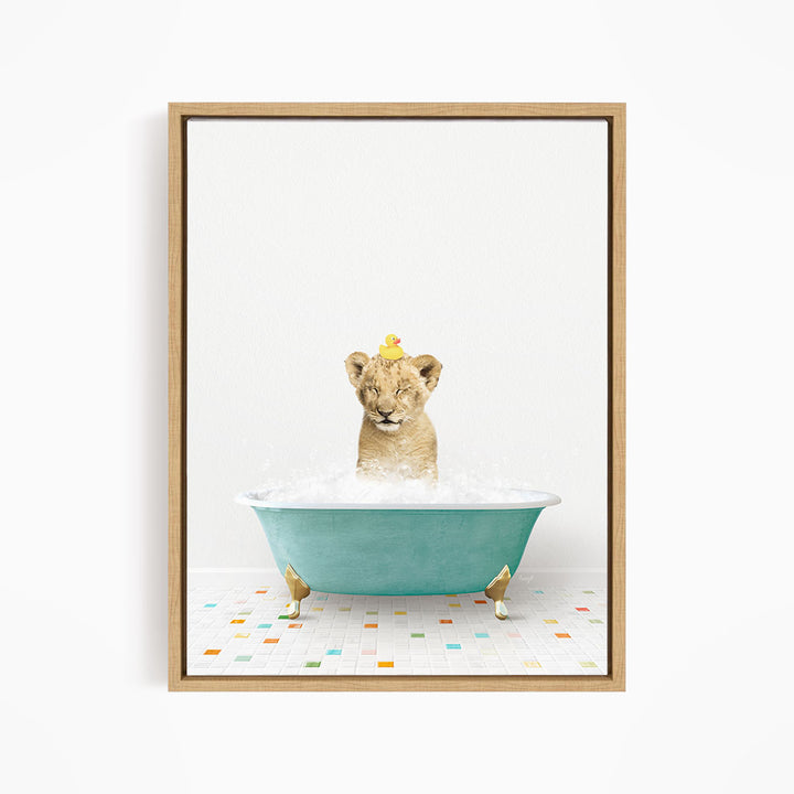 A young lion cub is sitting in a blue bathtub filled with water, with a yellow rubber duck perched on its head.