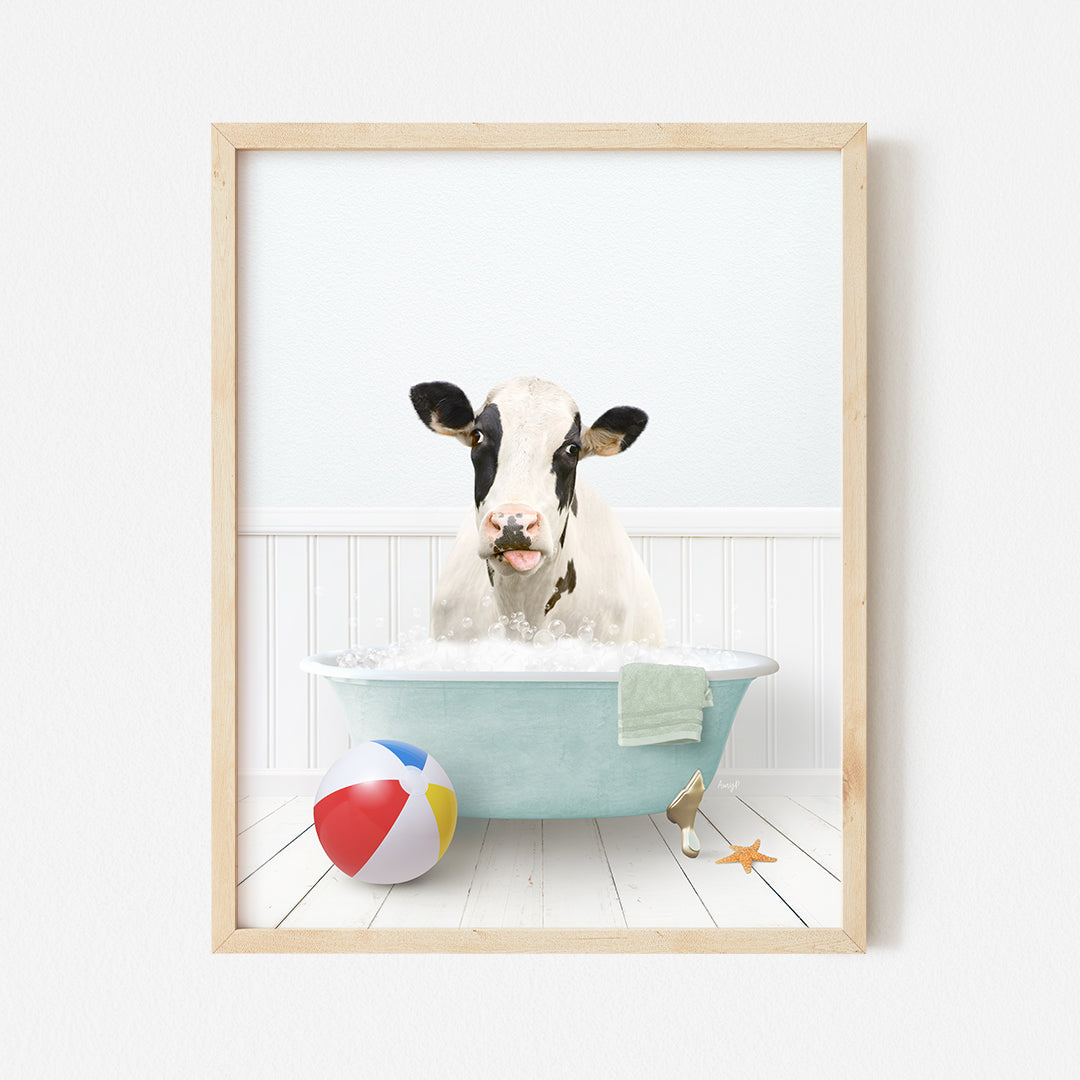 a cow in a bathtub with a beach ball