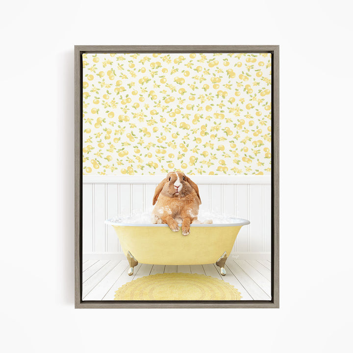A brown rabbit sitting in a yellow bathtub filled with water, surrounded by a yellow floral pattern on the wall behind it.