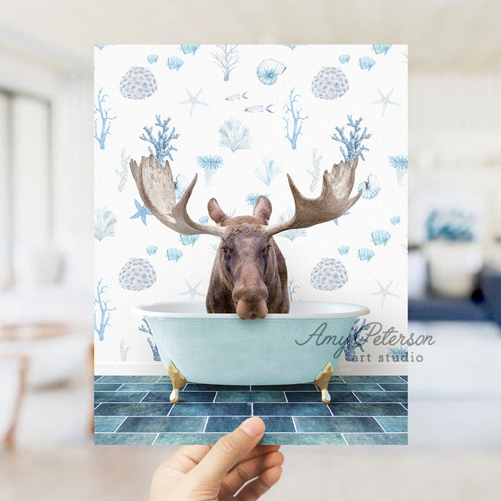 a person holding up a card with a picture of a moose in a bathtub