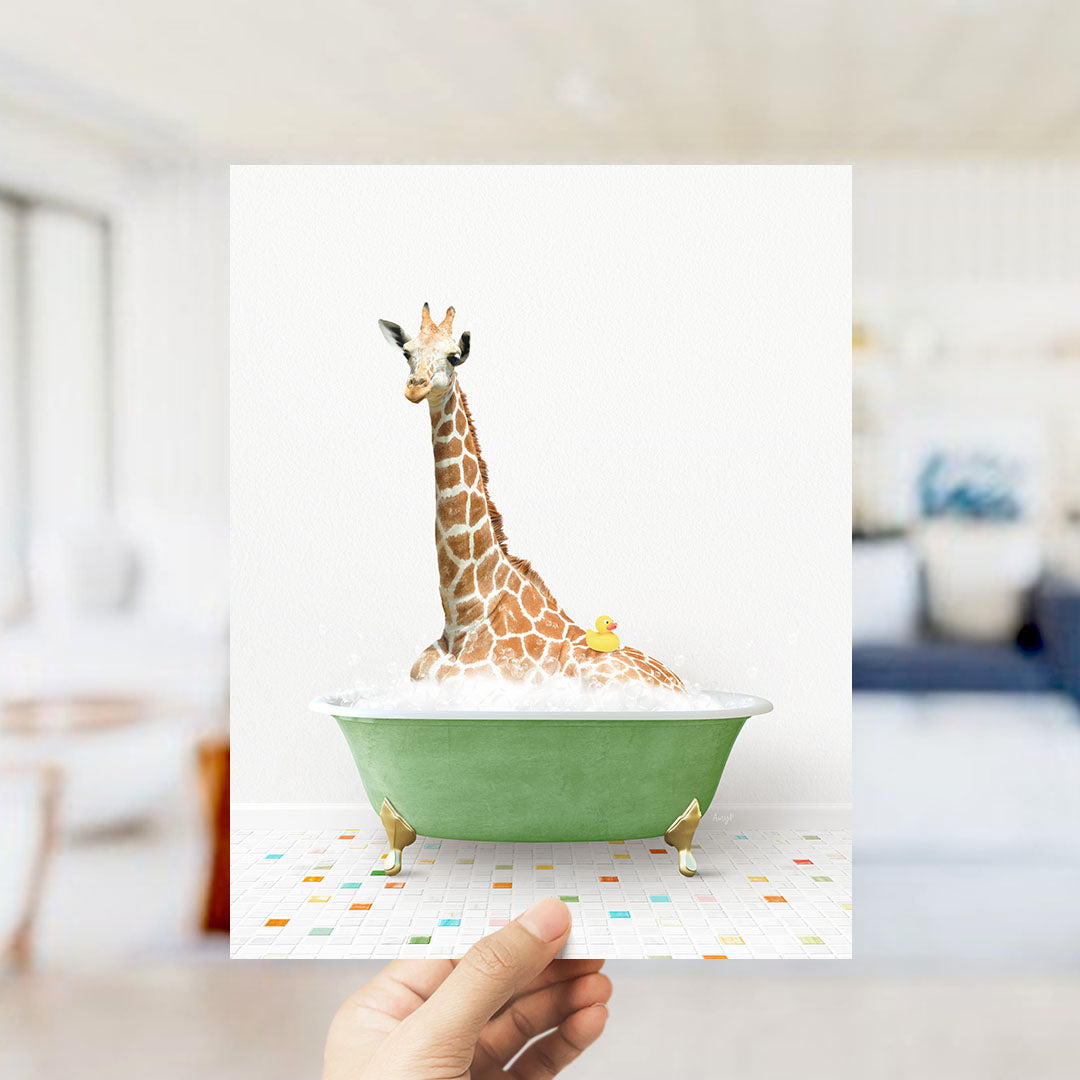 A giraffe sitting in a green bathtub filled with bubbles, with a rubber duck floating in the water.