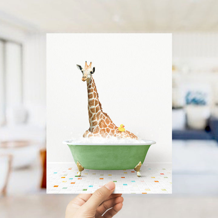 A giraffe sitting in a green bathtub filled with bubbles, with a rubber duck floating in the water.