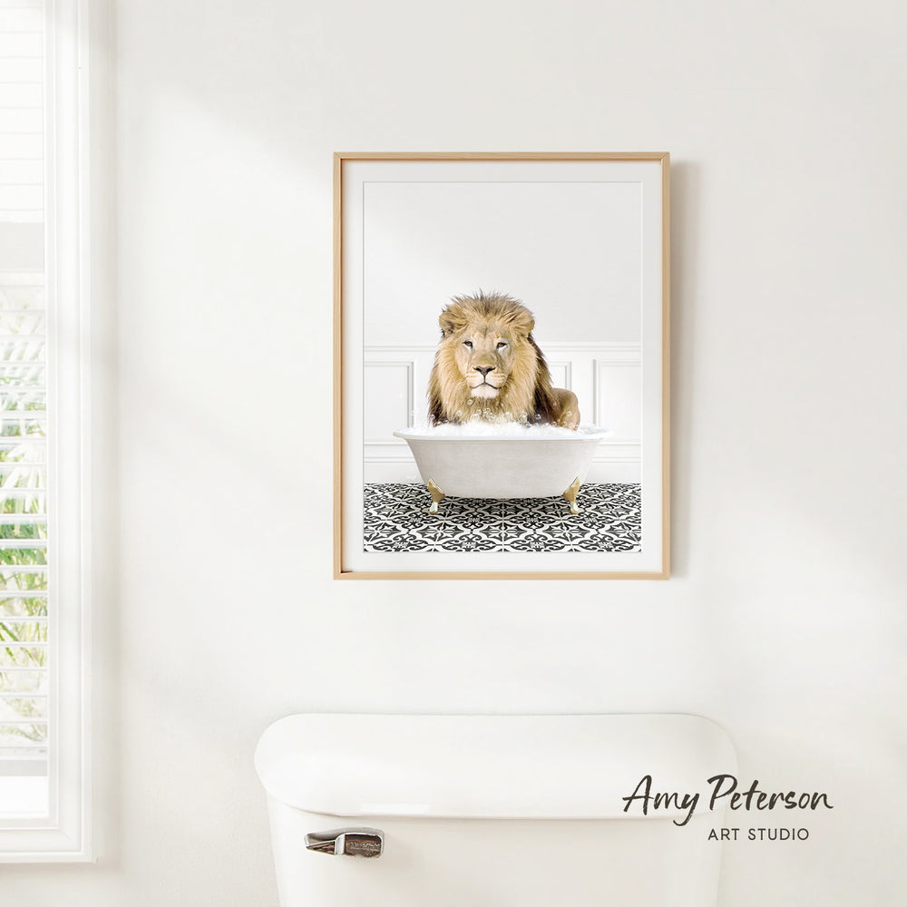 A framed image of a lion sitting in a bathtub, with a patterned tile floor beneath it.
