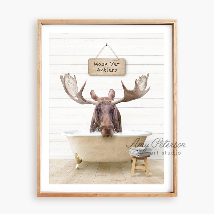 a moose is sitting in a bathtub with a sign above it