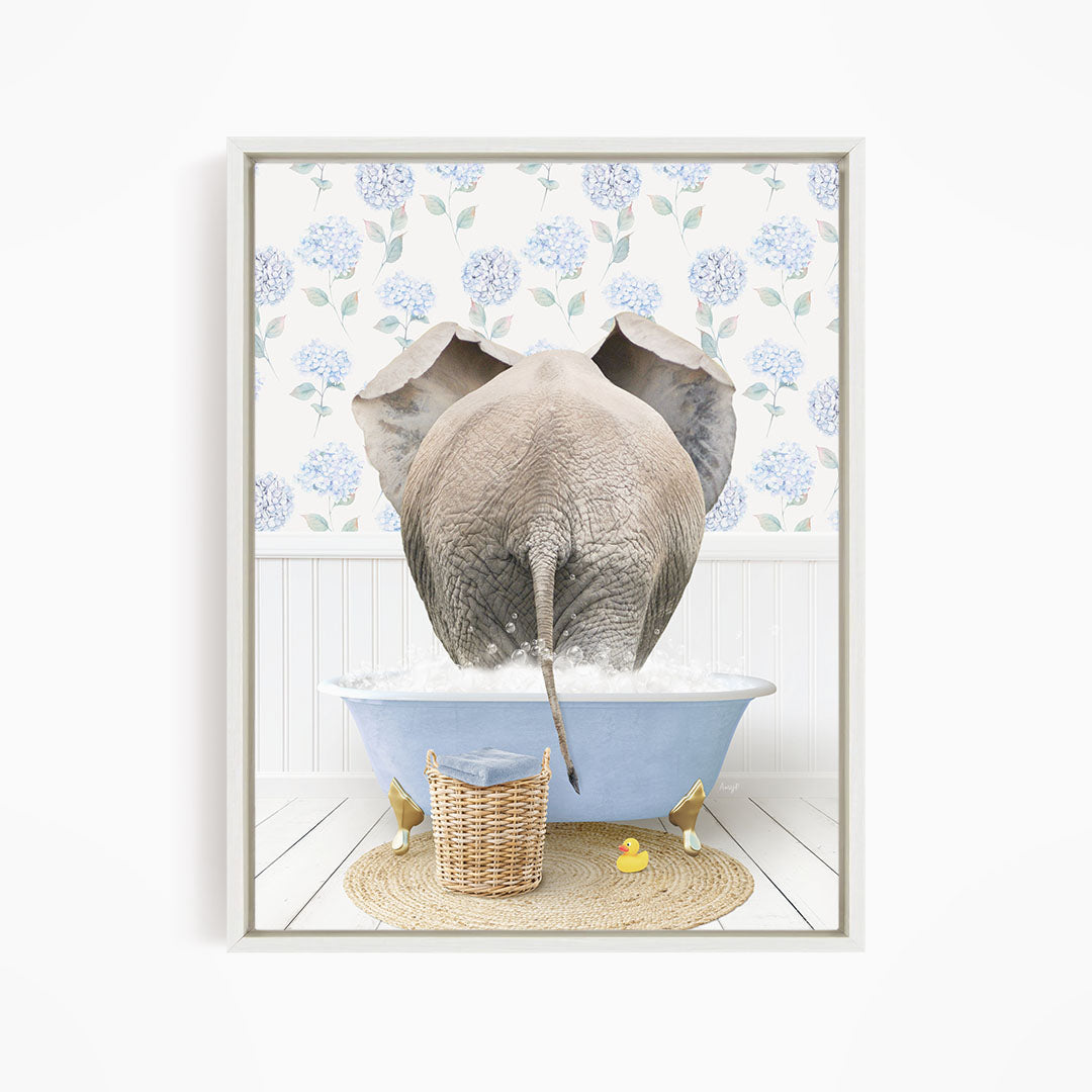 An elephant is taking a bath in a blue bathtub, surrounded by a wicker basket and a yellow rubber duck.