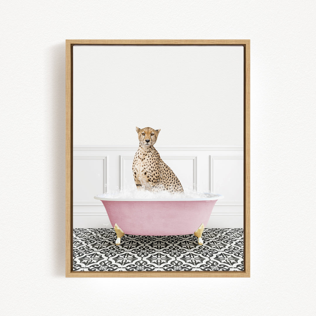 A cheetah sitting in a pink bathtub filled with bubbles, surrounded by a black and white patterned floor.