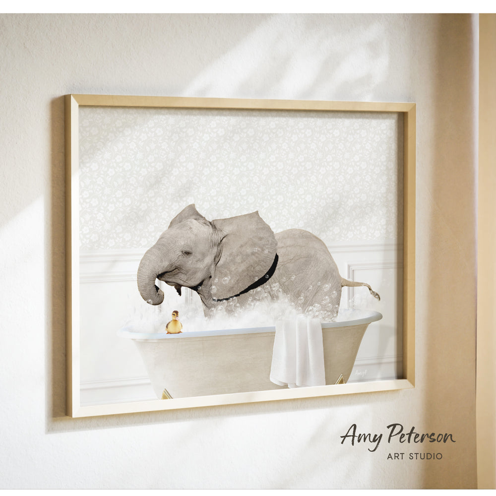 A framed image depicting an elephant sitting in a bathtub, with a person standing next to it.