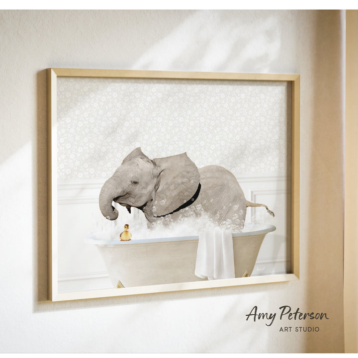 A framed image depicting an elephant sitting in a bathtub, with a person standing next to it.