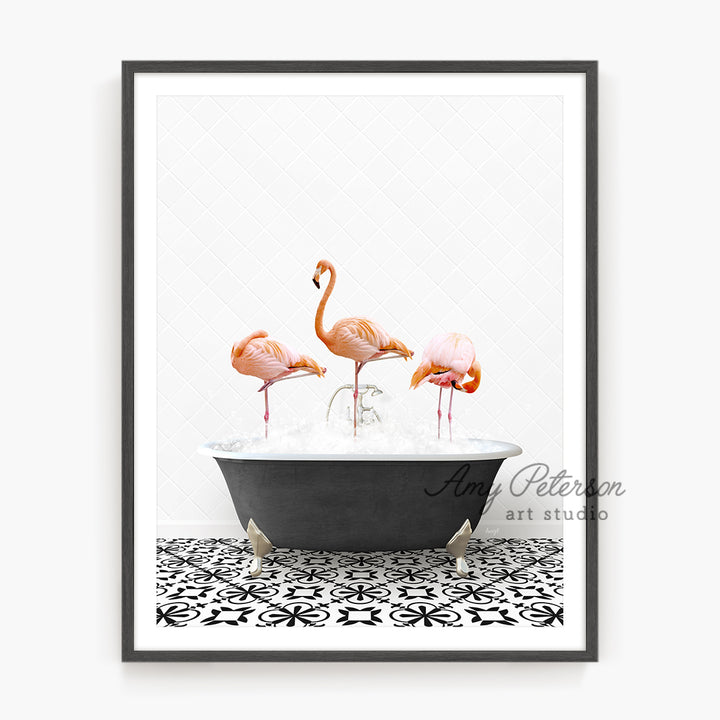 three flamingos in a bathtub with water in it