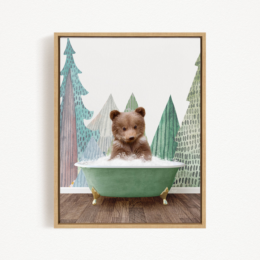 A brown bear sitting in a green bathtub, surrounded by a forest scene with trees and a snowy landscape.