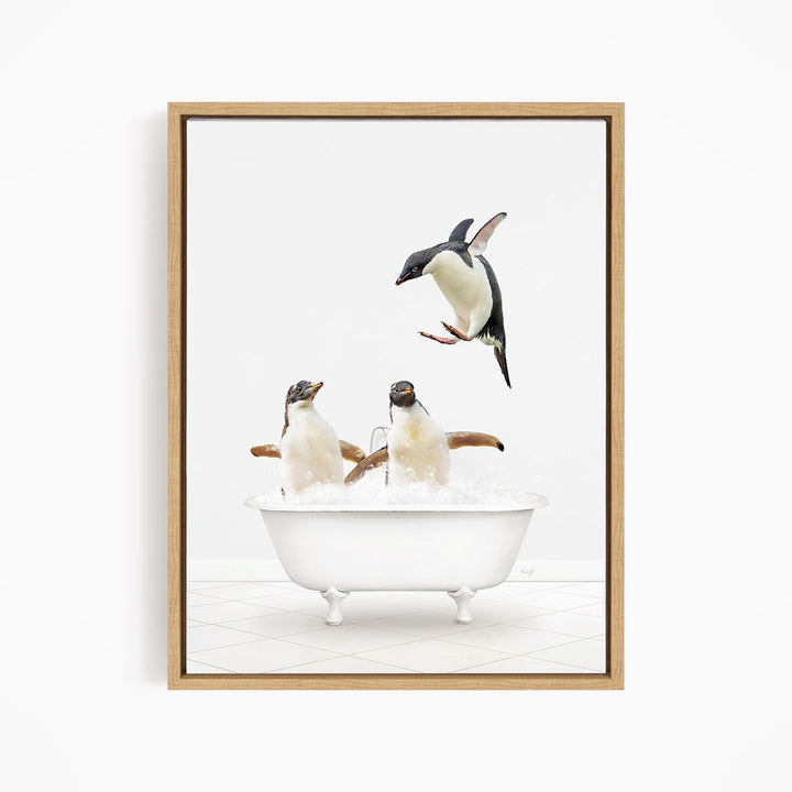 A framed image depicting two penguins sitting in a bathtub, with one penguin flying towards the other penguin.