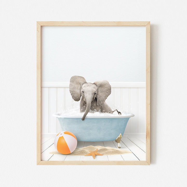 an elephant taking a bath in a blue bathtub