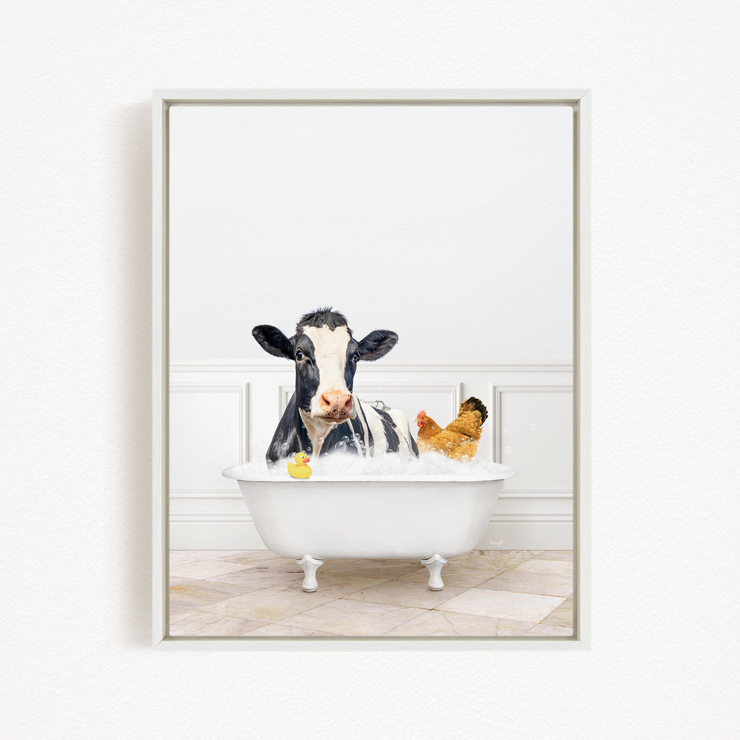 A black and white cow is sitting in a white bathtub filled with water, surrounded by a yellow rubber duck and a chicken.