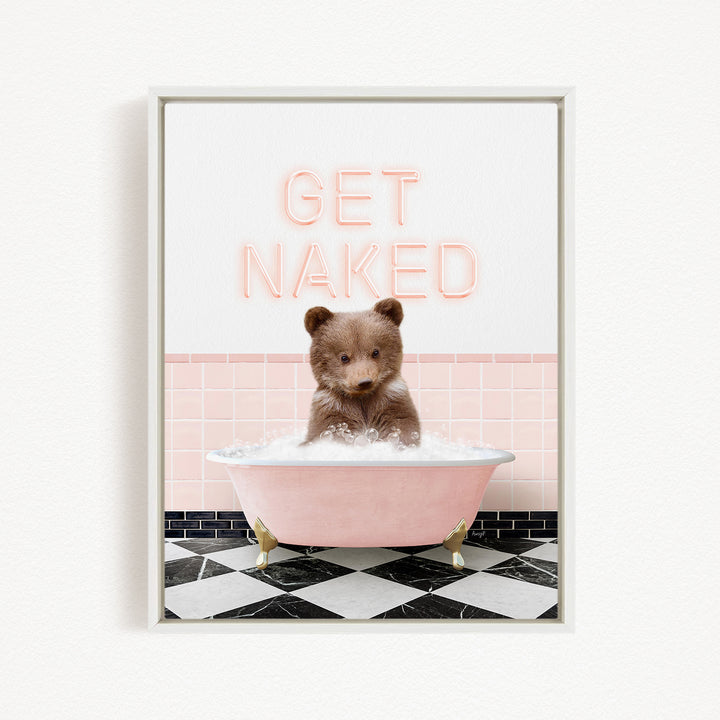 A cute brown bear sitting in a pink bathtub filled with bubbles, with the text "GET NAKED" displayed above it.