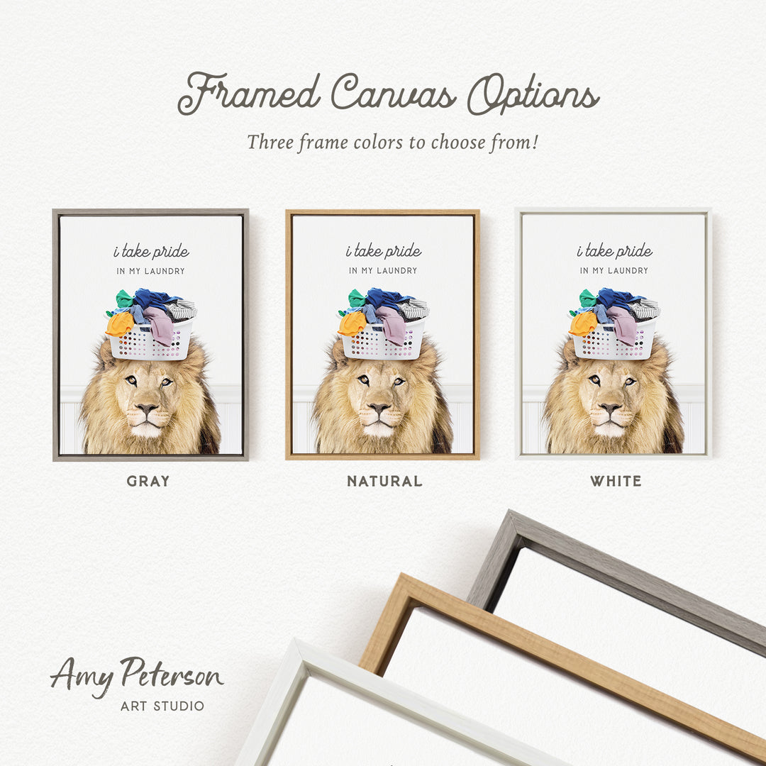 The image is a framed canvas with three different color options for a picture of a lion with a basket of laundry on its head.