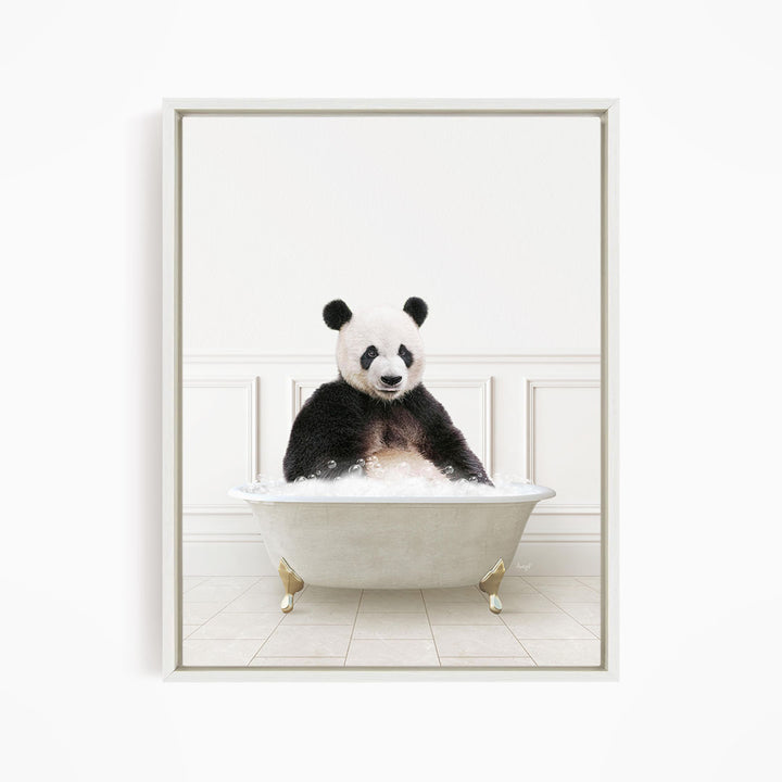 A panda bear sitting in a white bathtub filled with bubbles, appearing to enjoy the bath.