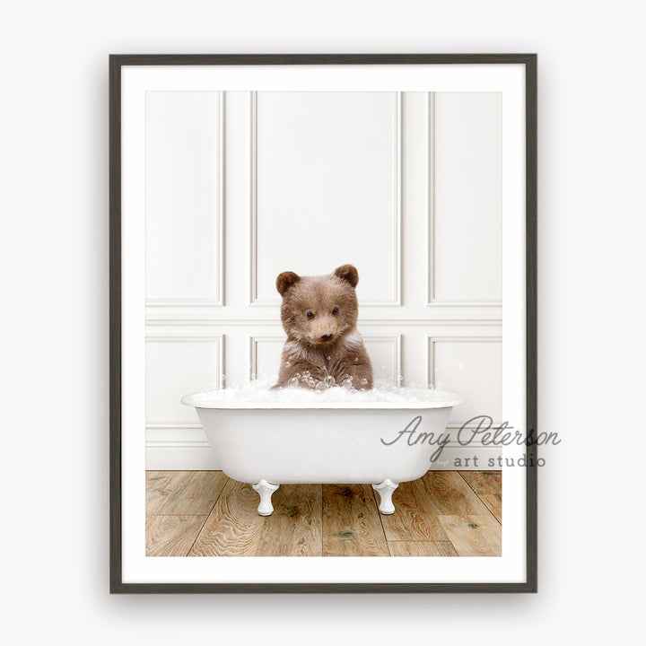 a brown teddy bear sitting in a bath tub