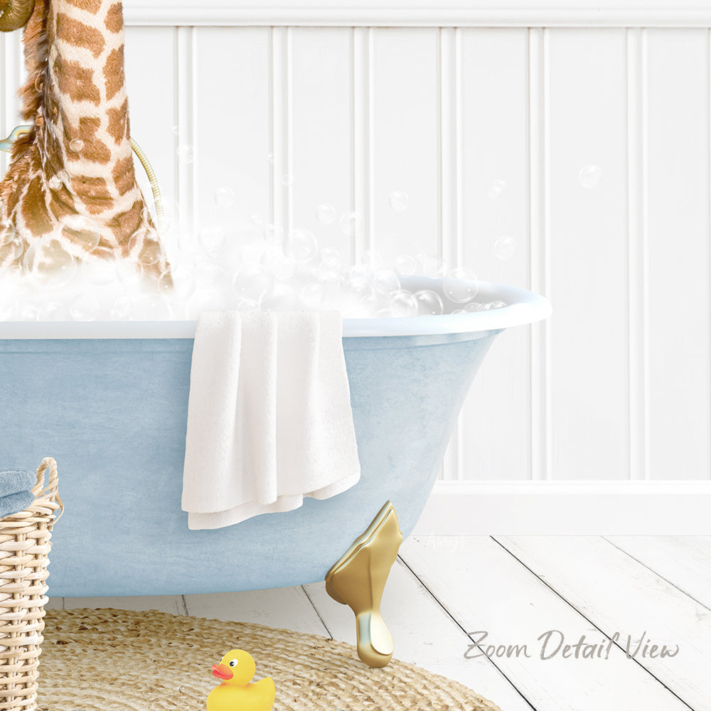 A blue claw-foot bathtub filled with bubbles, with a towel hanging on the side and a yellow rubber duck sitting in the water.