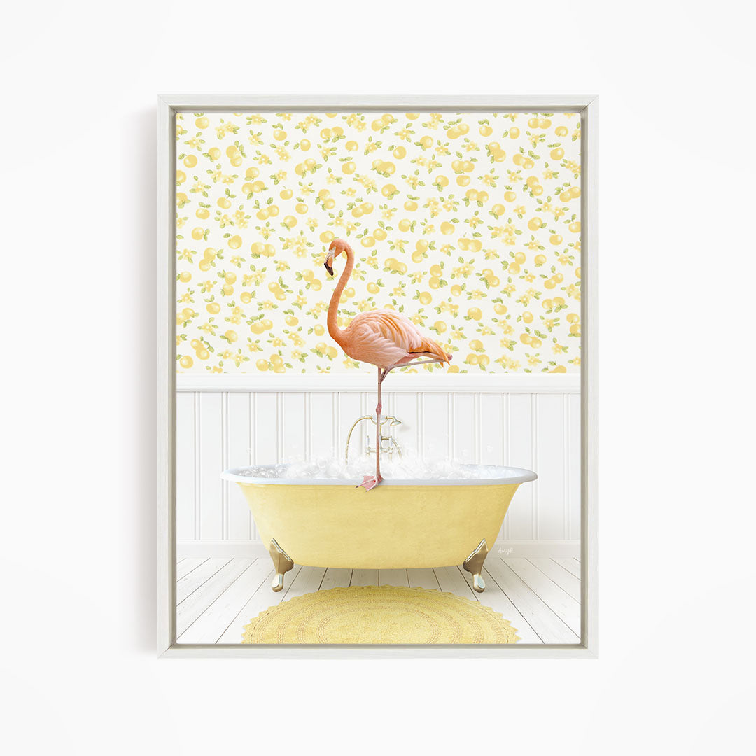 A pink flamingo stands on the edge of a yellow clawfoot bathtub, with a yellow and white floral wallpaper in the background.