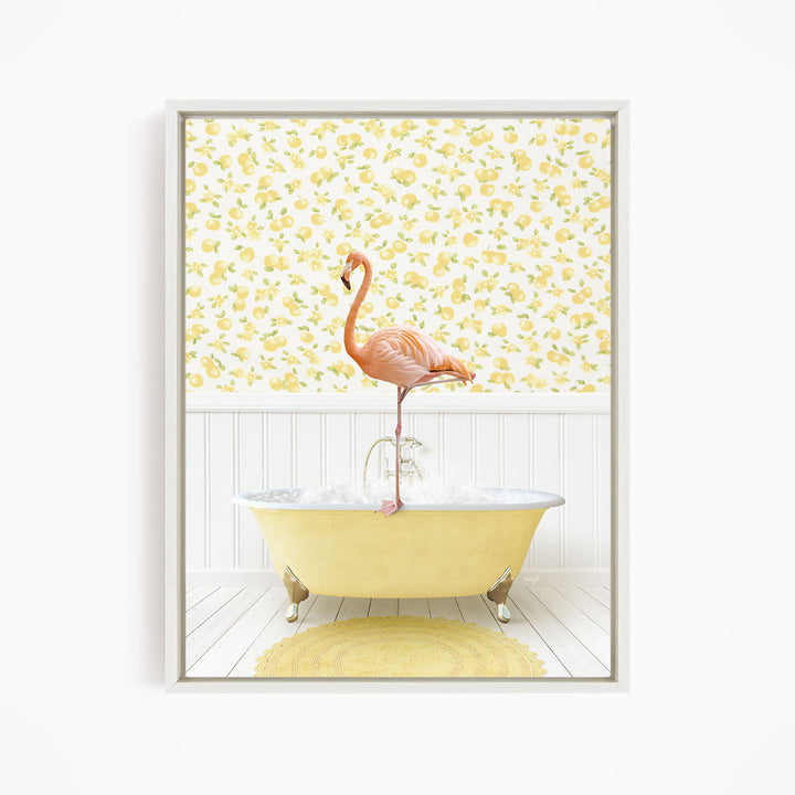 A pink flamingo stands on the edge of a yellow clawfoot bathtub, with a yellow and white floral wallpaper in the background.