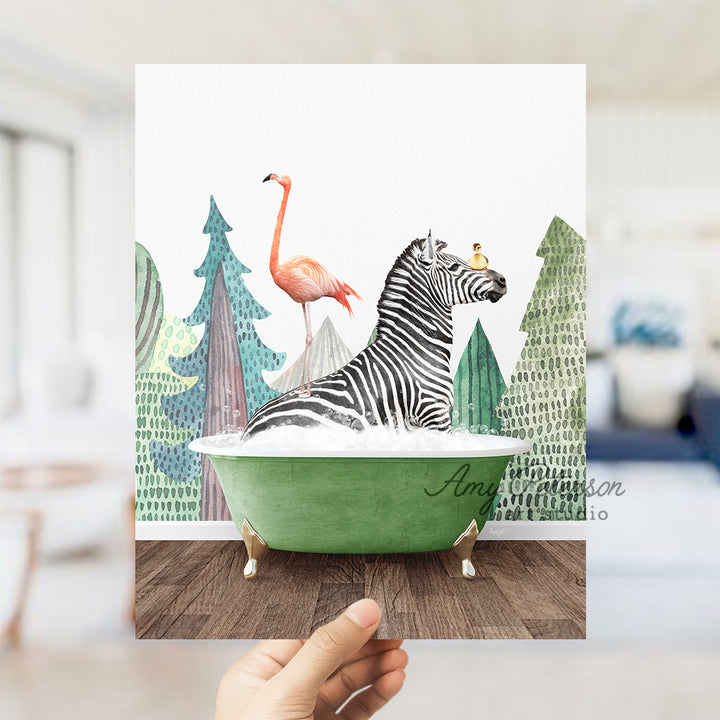 a hand holding up a card with a zebra and a flamingo in a bath